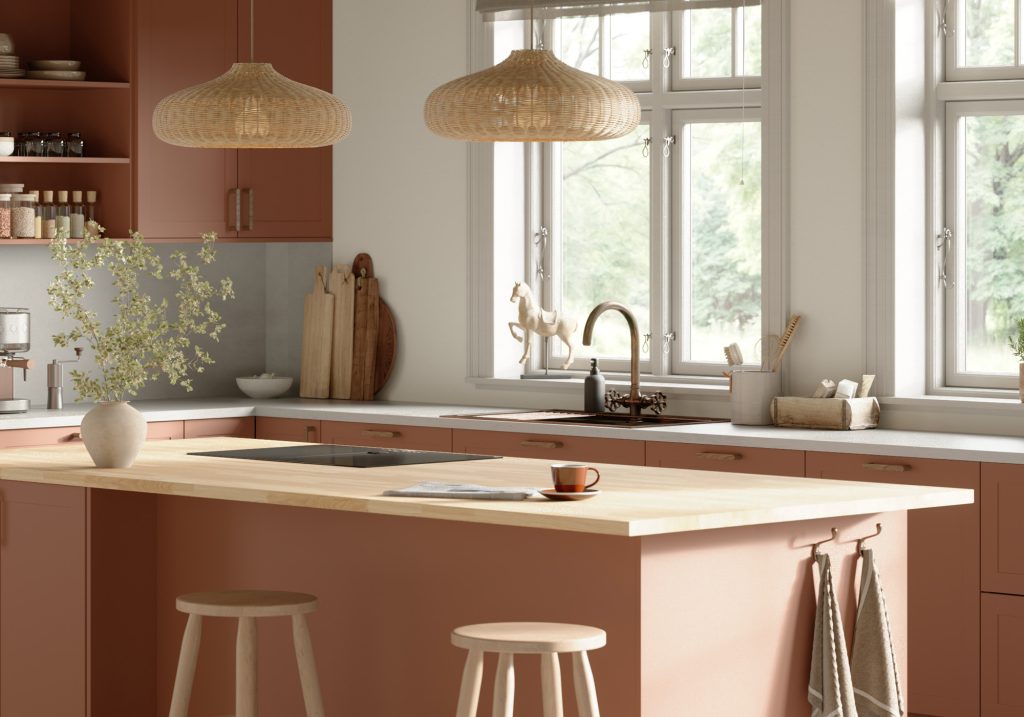Detaljbild av modernt terrakottafärgat kök.