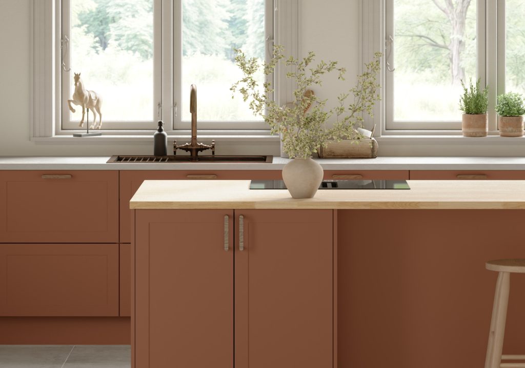 Detaljbild av modernt terrakottafärgat kök.